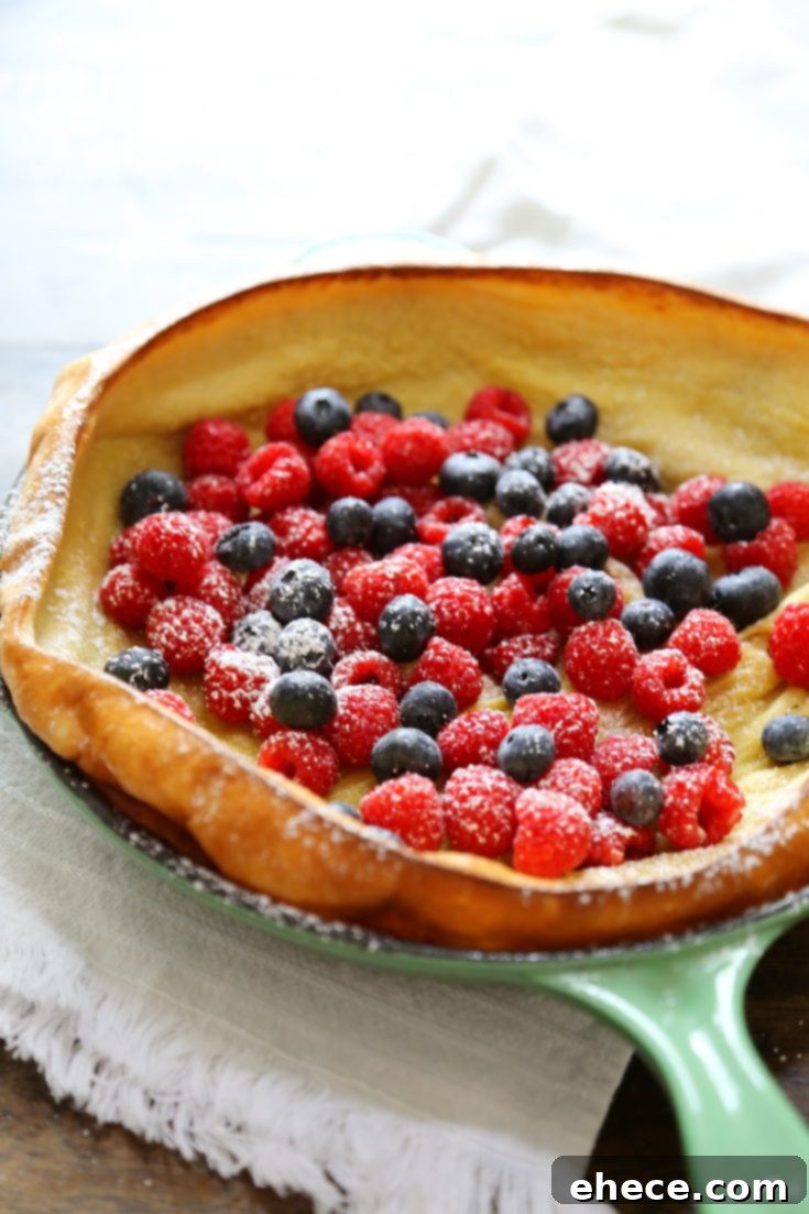 Dutch Baby Pancake with berries and whipped cream on Pinterest
