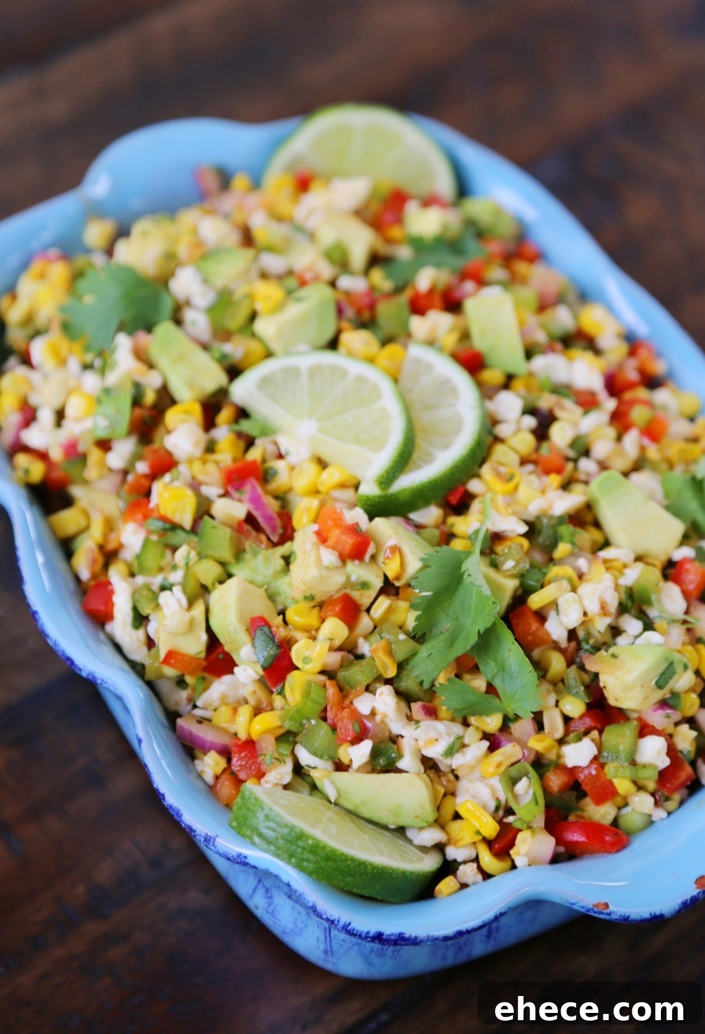Mexican Street Corn Salad - Close-up of the vibrant salad ingredients: charred corn, bell peppers, cilantro, and Cotija cheese.