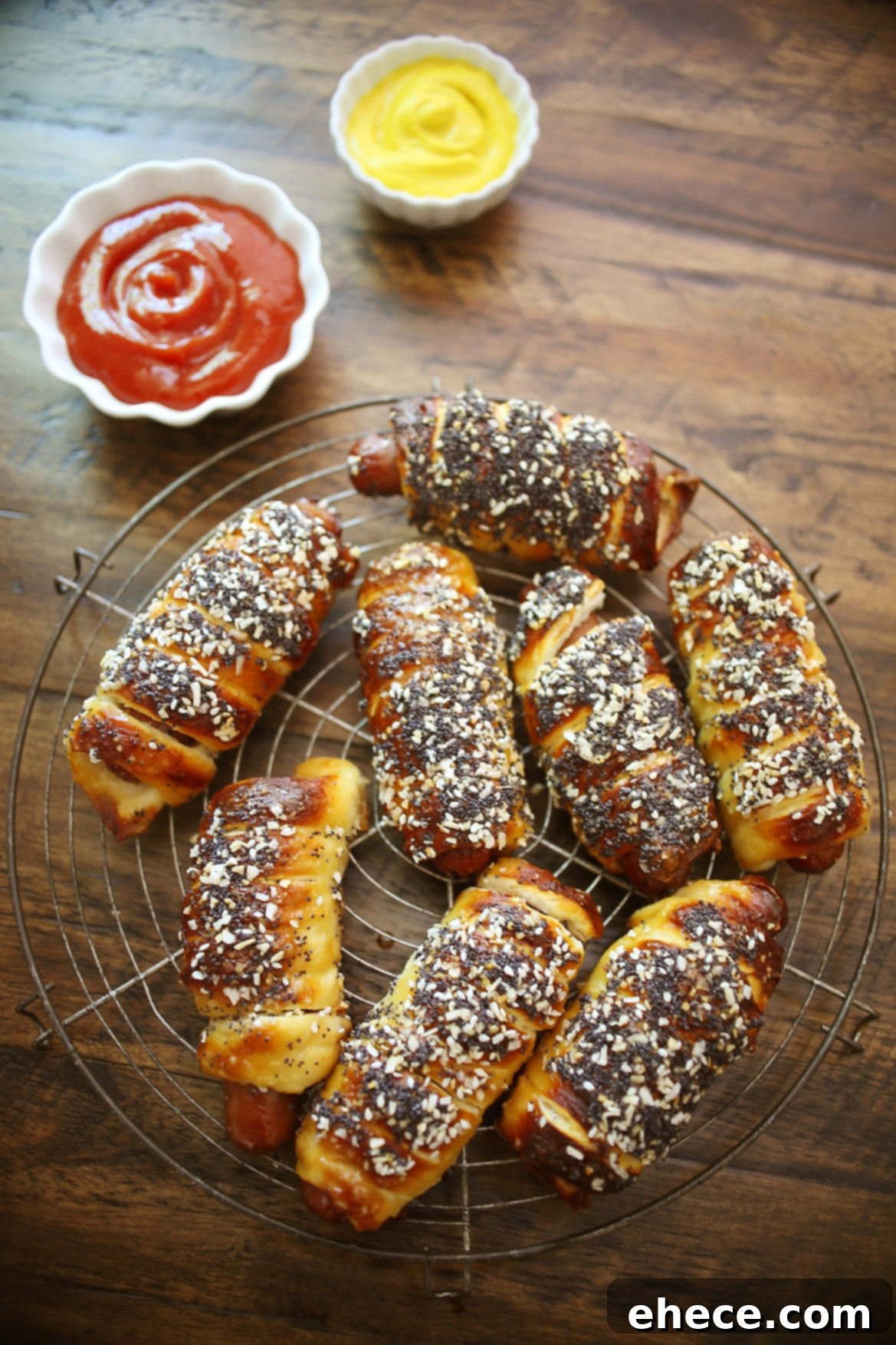 Close-up of biscuit dough being wrapped around a hot dog