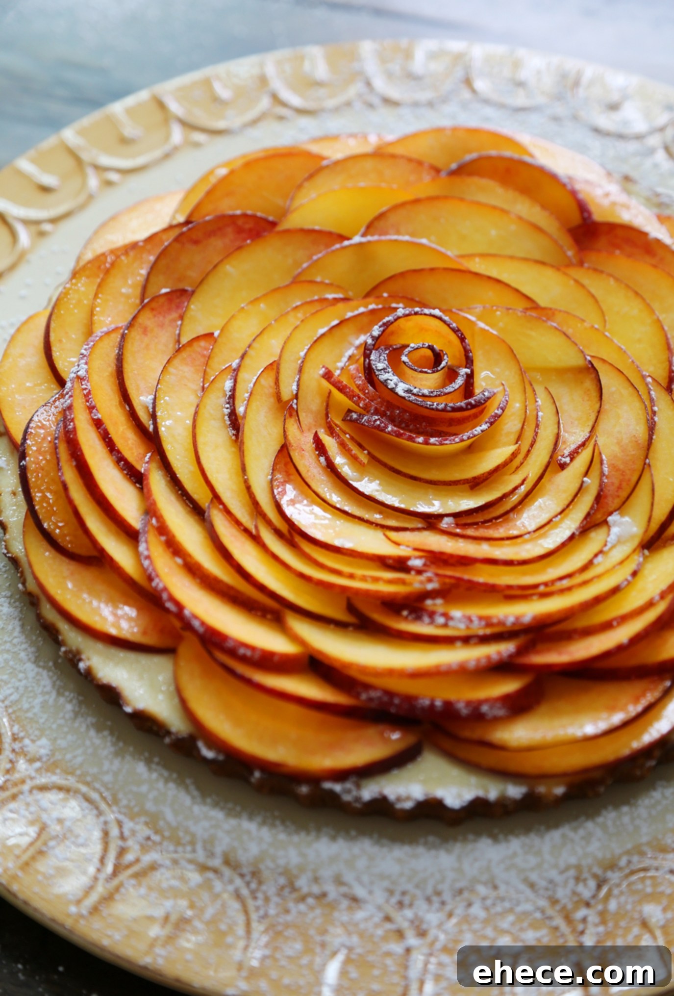 Overhead view of a Creamy Peach and Honey Tart adorned with a generous, colorful fresh fruit topping.