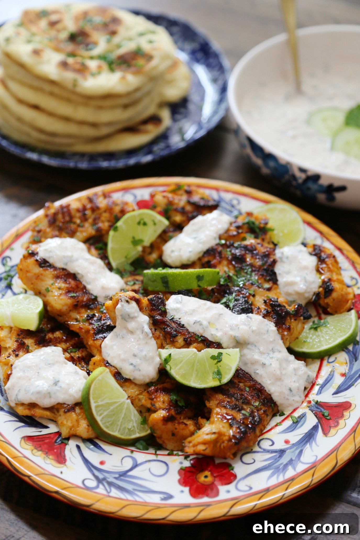 Sizzling Chili Lime Chicken with Refreshing Cucumber Mint 5 A bowl of creamy Cucumber-Mint Sauce, garnished with fresh mint leaves, ready to be served.