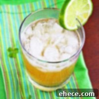 Irish Buck Cocktail with lime garnish on a rustic wooden surface