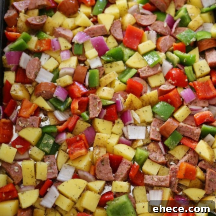 One-Pan Roasted Sausage, Peppers and Potatoes recipe card image.