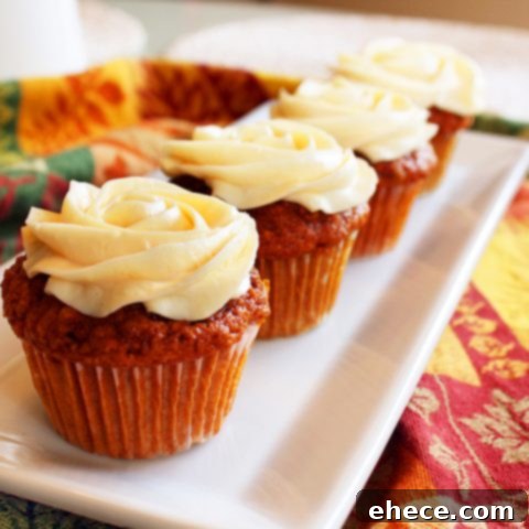 Spiced Carrot Cupcakes Crowned with Cream Cheese Bliss 2 Moist Carrot Cupcakes with Cream Cheese Frosting