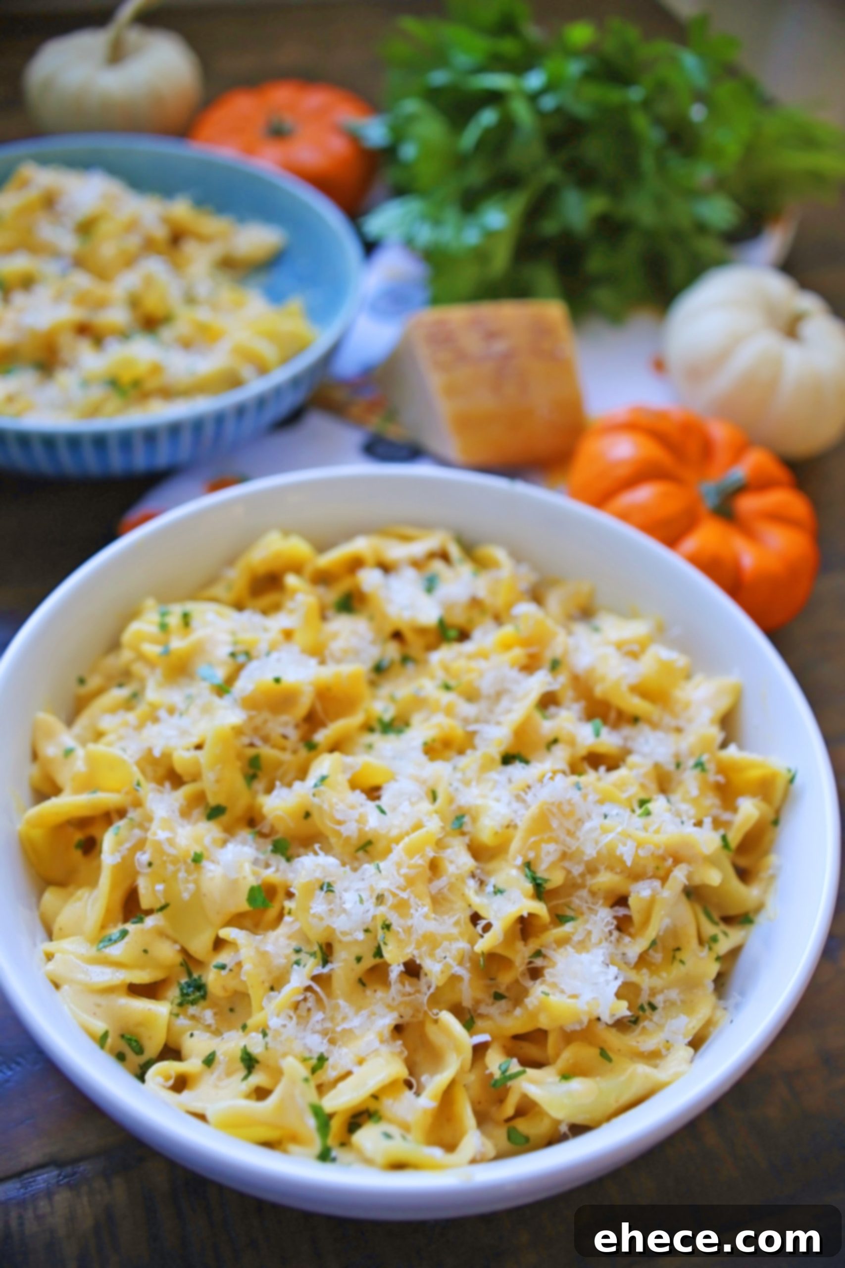 Velvety Pumpkin Alfredo 3 Close-up of creamy pumpkin alfredo pasta with a fork lifting a portion.
