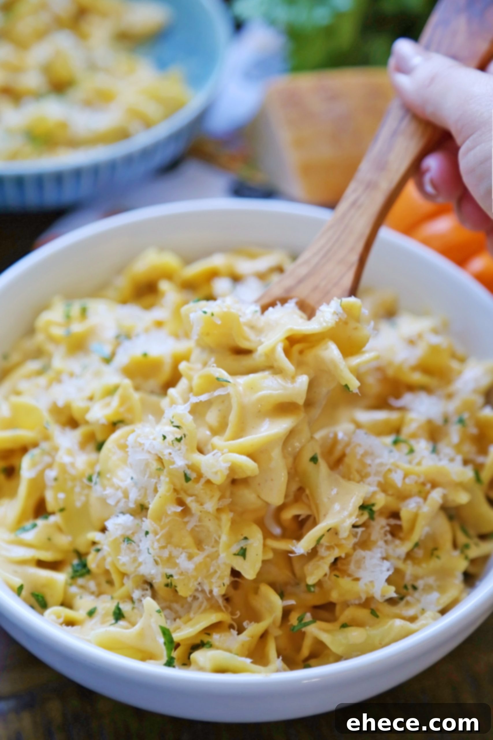 A pot of rich, creamy Pumpkin Alfredo sauce, ready for pasta