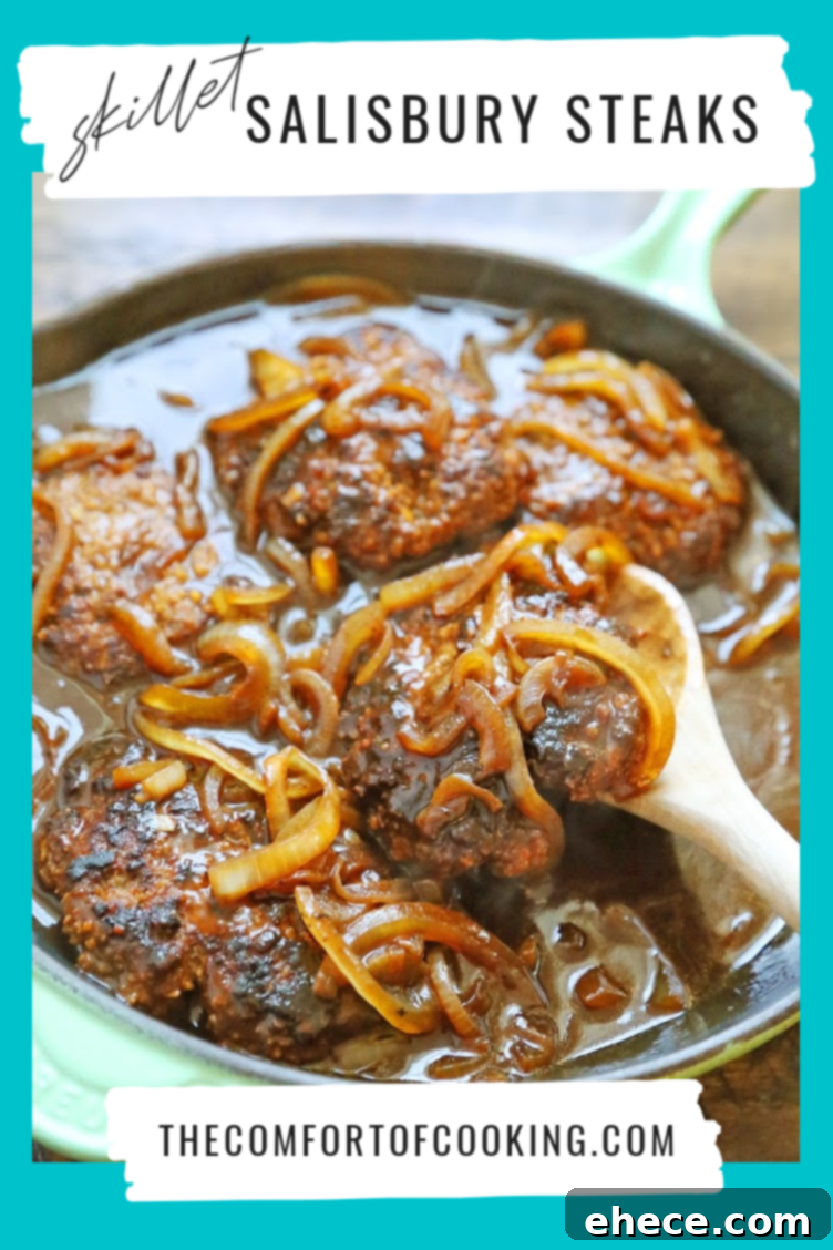 Skillet Salisbury Steak on a plate with greens