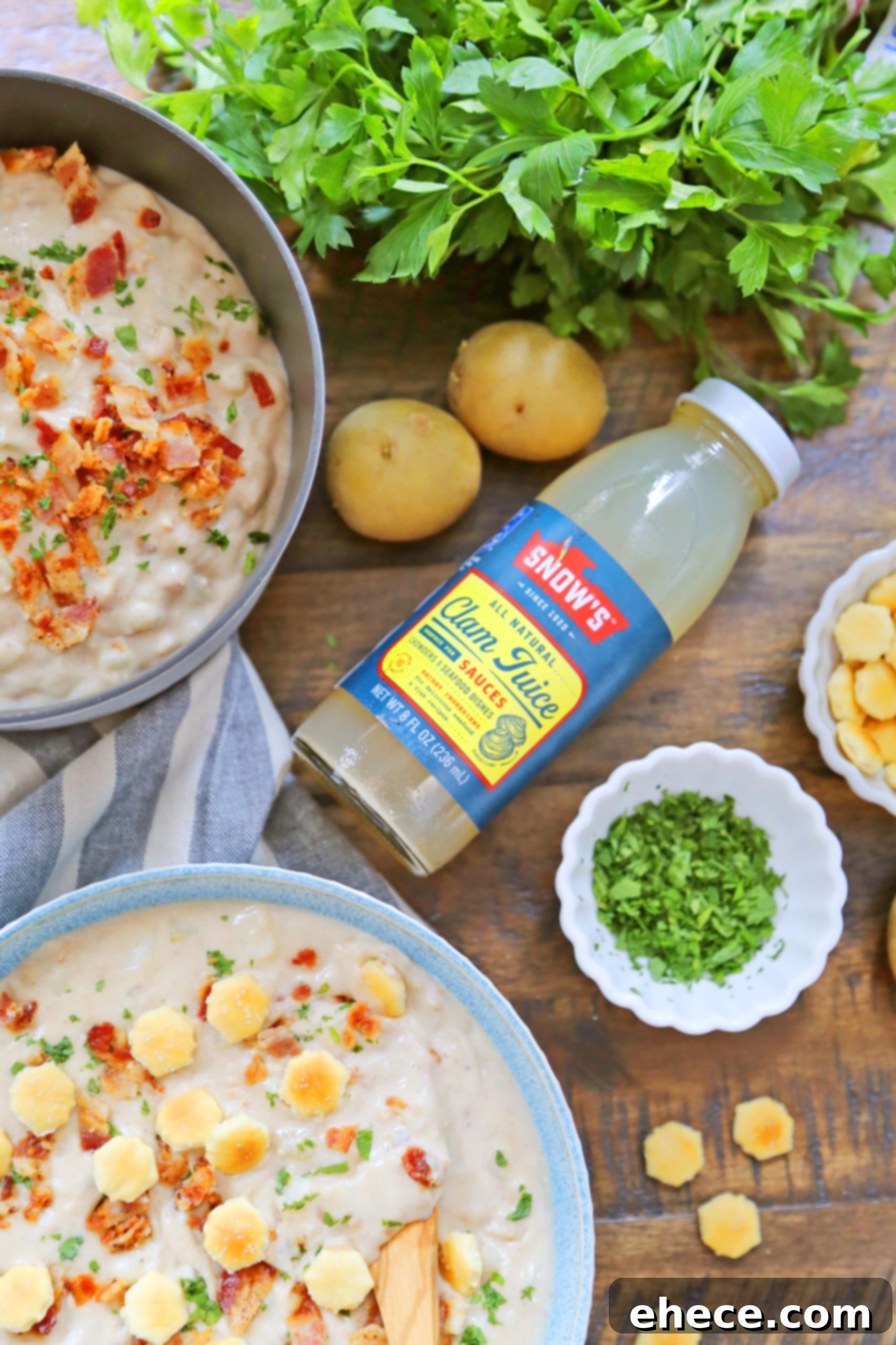 Overhead shot of clam chowder with fresh herbs