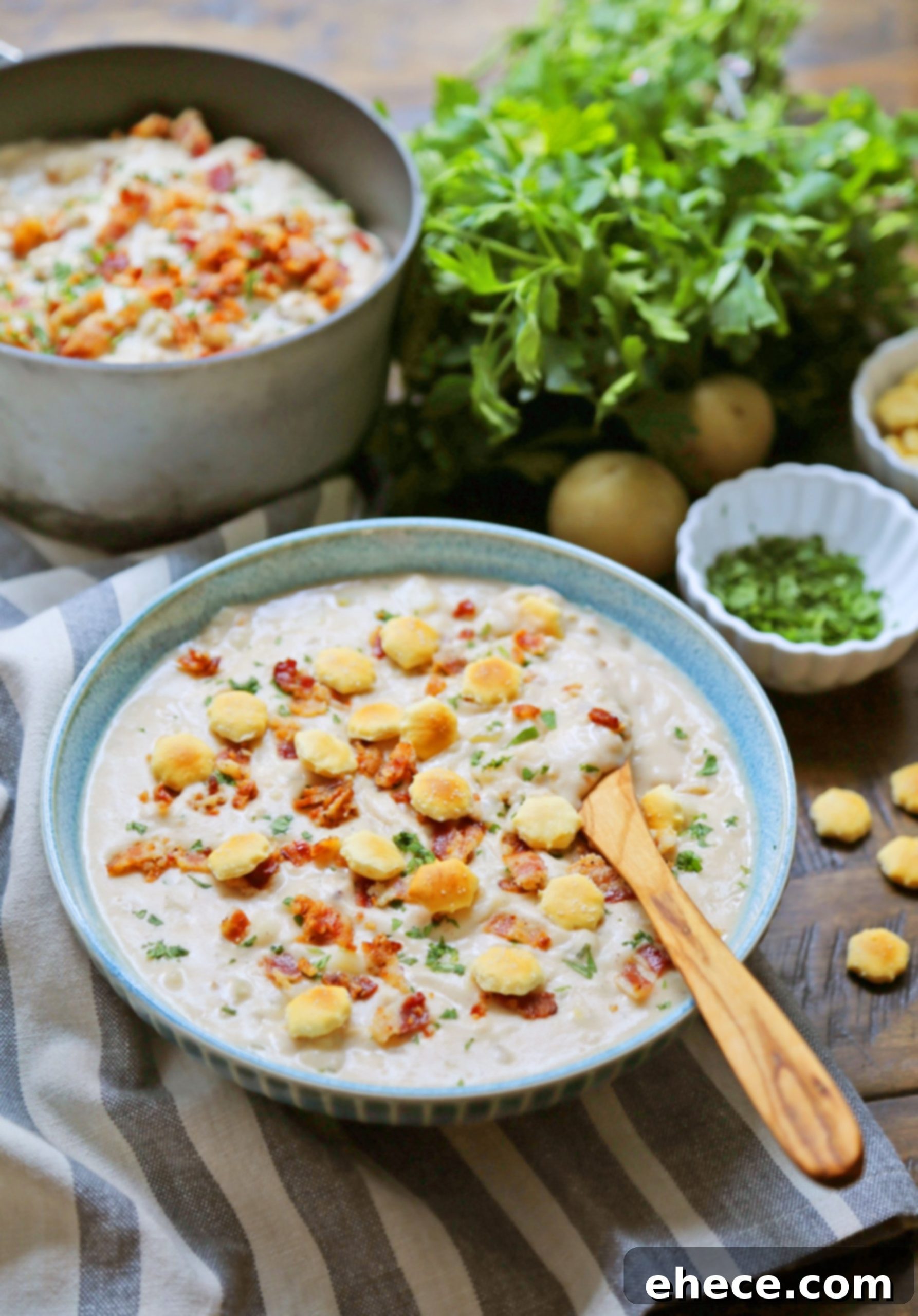 Clam chowder being poured into a bread bowl