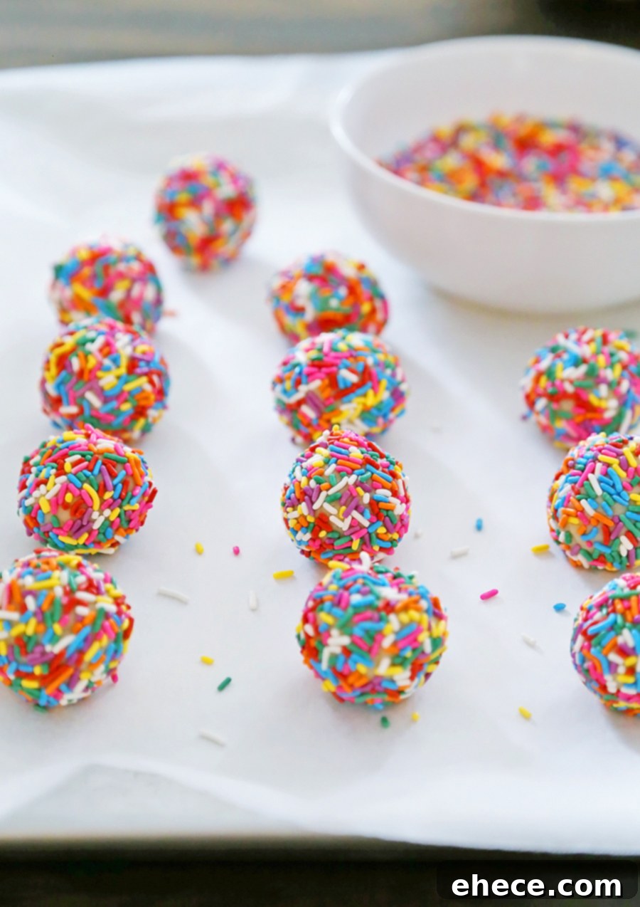 Close-up of Rainbow Sprinkle Cookies on a baking sheet