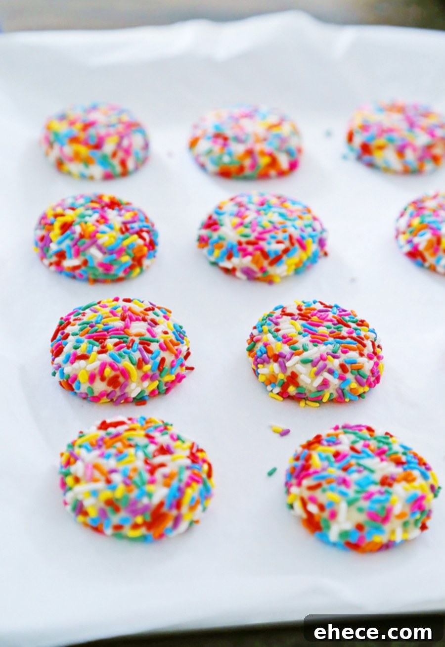 Stack of Rainbow Sprinkle Cookies on a white background