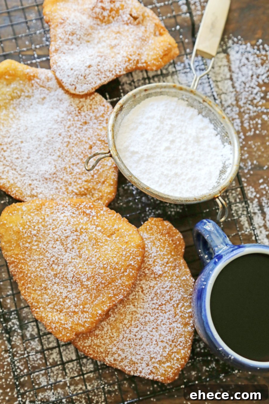 Golden, puffy fried dough on a plate, ready to be enjoyed