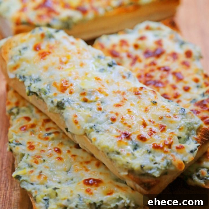 Cheesy Spinach-Artichoke Bread, golden brown and garnished.