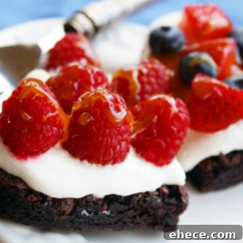 Decadent Brownie, Cream and Fresh Fruit Tarts, perfect for a romantic Valentine's Day dessert