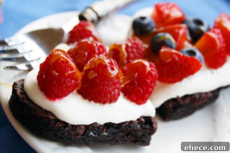 Close-up of a brownie tart with fresh fruit and cream