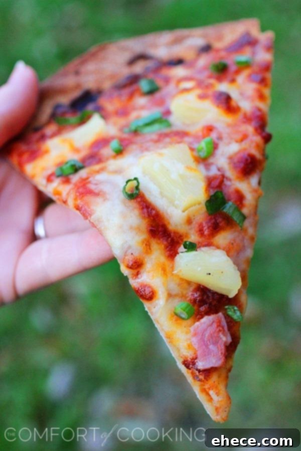 Tropical BBQ Ham Pizza 4 Freshly cut slice of BBQ Ham and Pineapple Pizza ready to be served