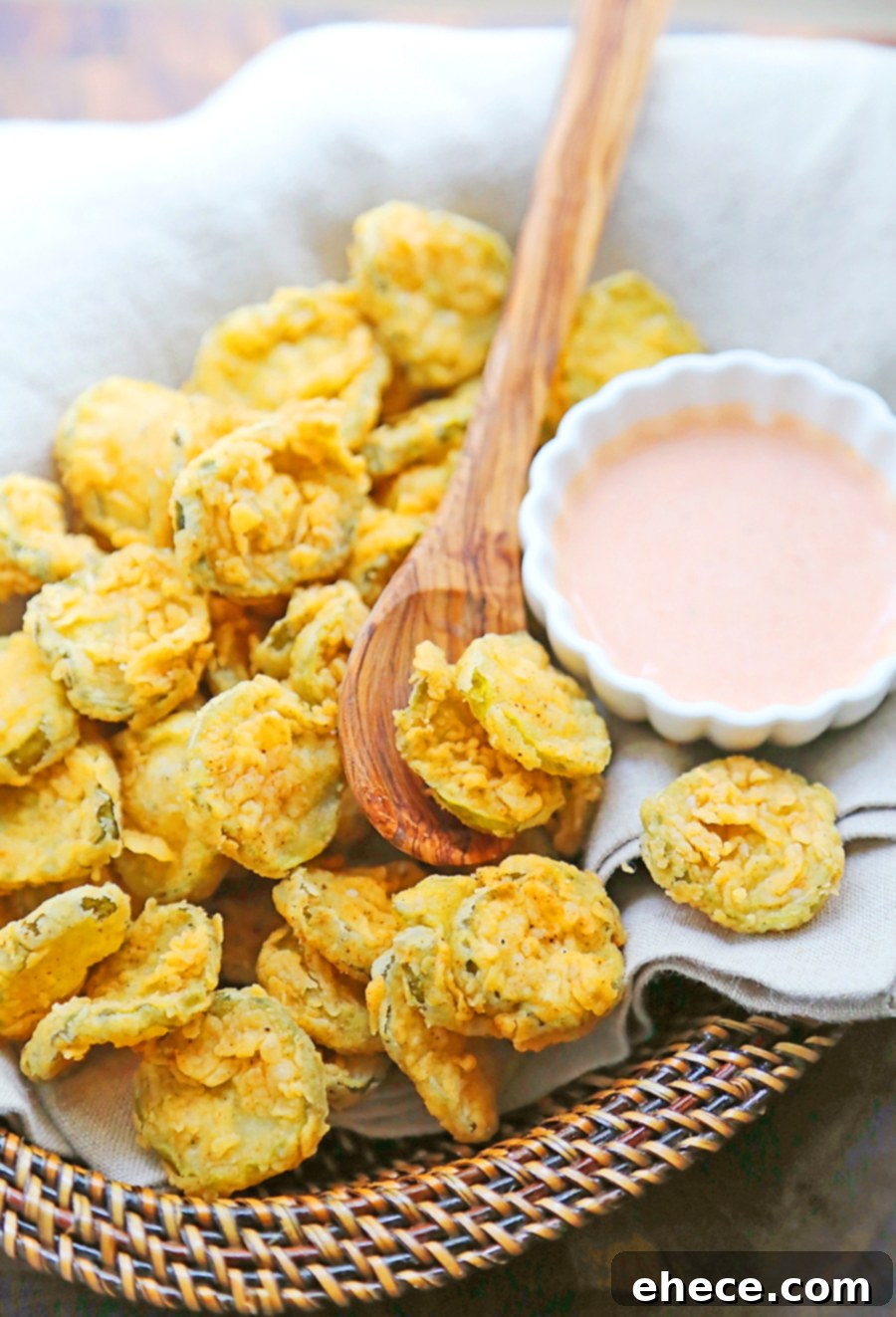 Golden crispy fried pickles served with ranch dipping sauce