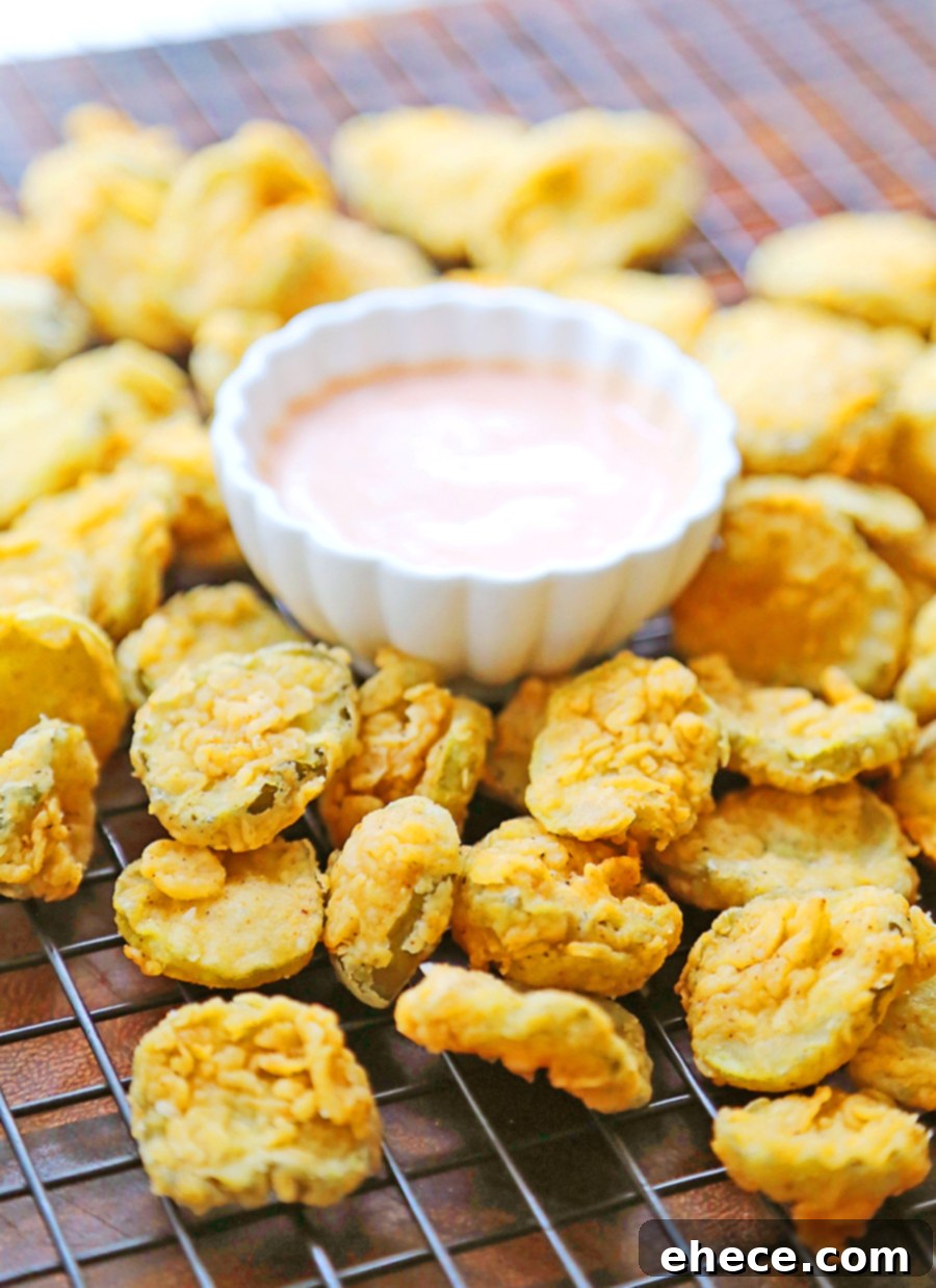 Assortment of fried pickles with dipping sauces