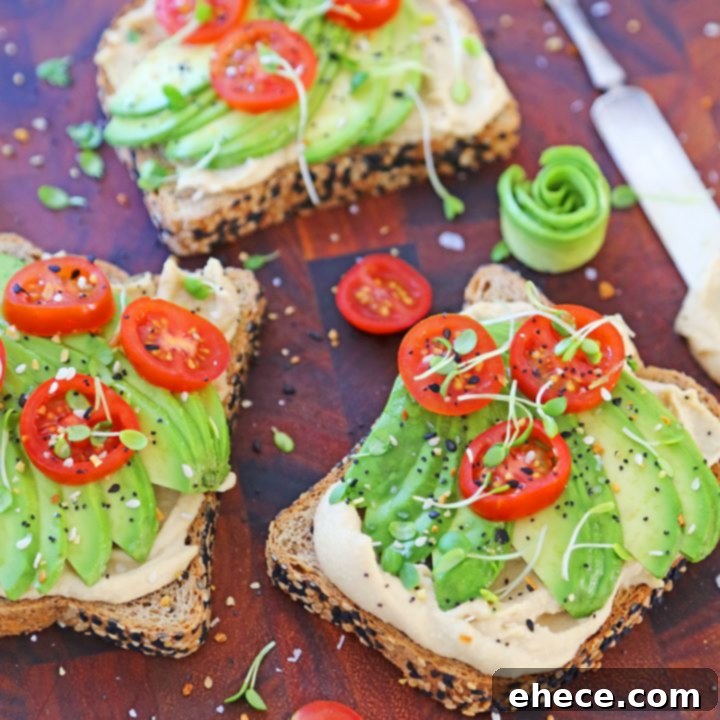 Quick Creamy Hummus Avocado Toast 5 A perfectly assembled 5-Minute Hummus Avocado Toast, ready to be enjoyed.