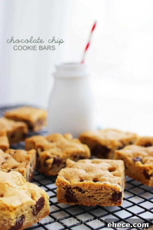 Chocolate chip cookie bars cut into squares, showing their soft, chewy texture.