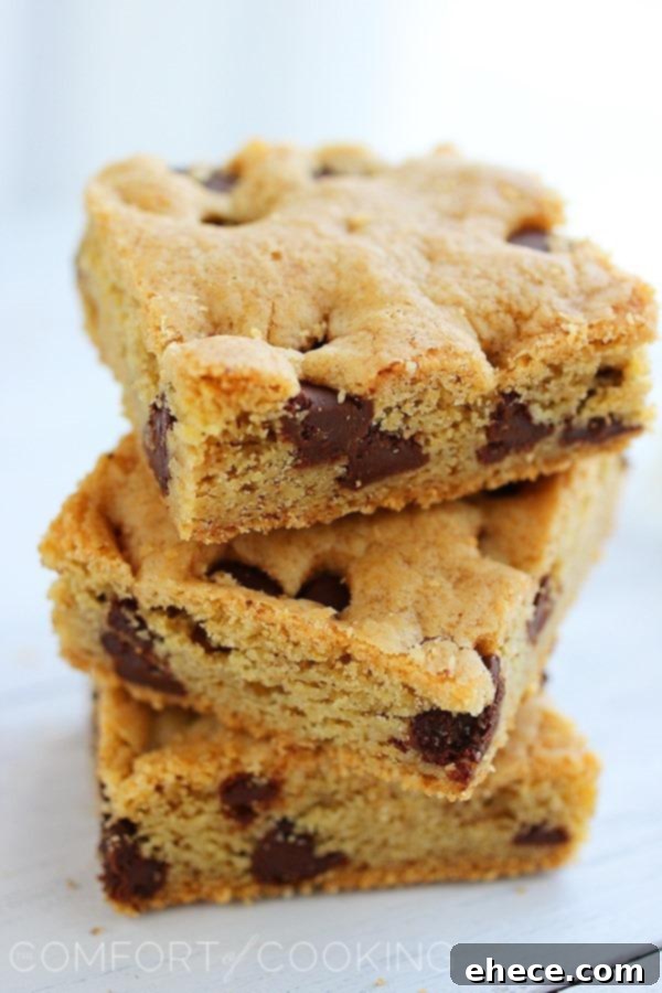 A whole pan of freshly baked chocolate chip cookie bars, ready to be cut.