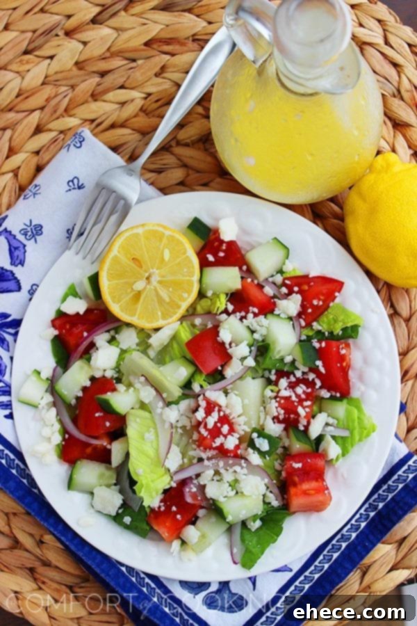 Hellenic Harvest with Lemon Kiss 4 A bowl of fresh Greek Salad with Lemon Vinaigrette, ready to be tossed and served, highlighting the vibrant colors of the ingredients.