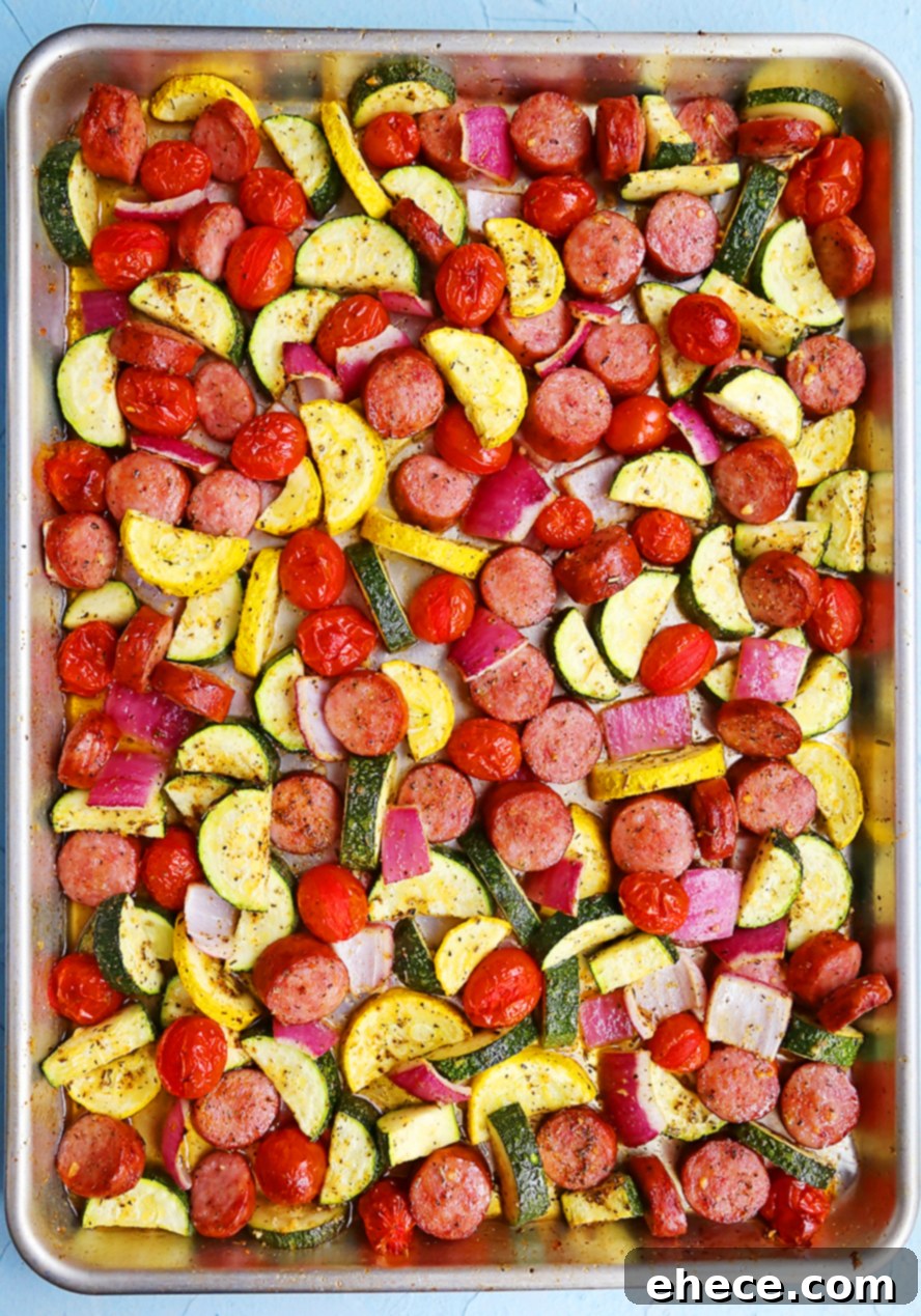 Easy One-Pan Sausage, Zucchini, and Tomato Dinner 4 Close-up of cooked sausage and vegetables in a bowl with a fork