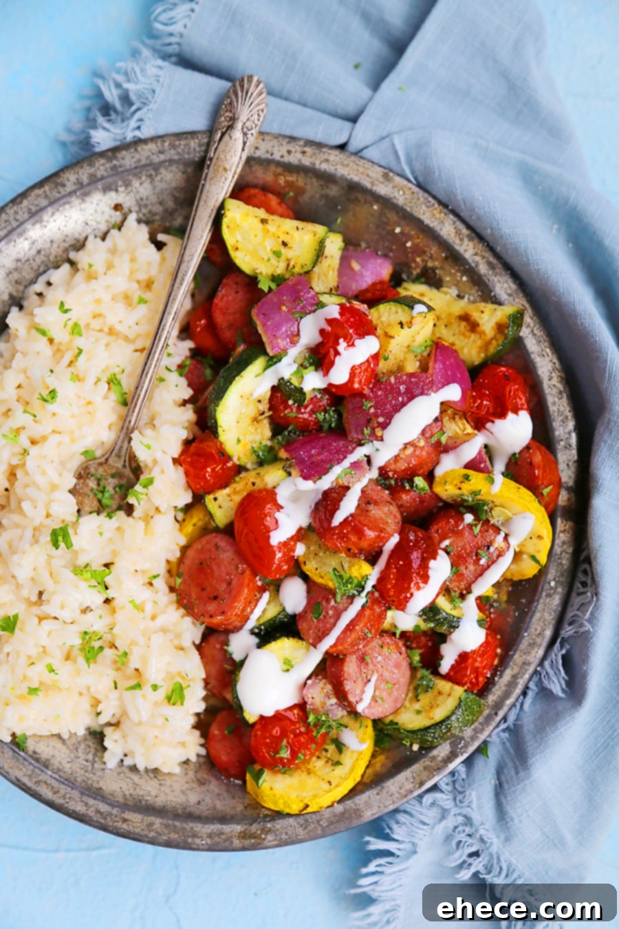 Easy One-Pan Sausage, Zucchini, and Tomato Dinner 5 Sausage, Zucchini, and Tomato Sheet Pan Dinner served on a plate