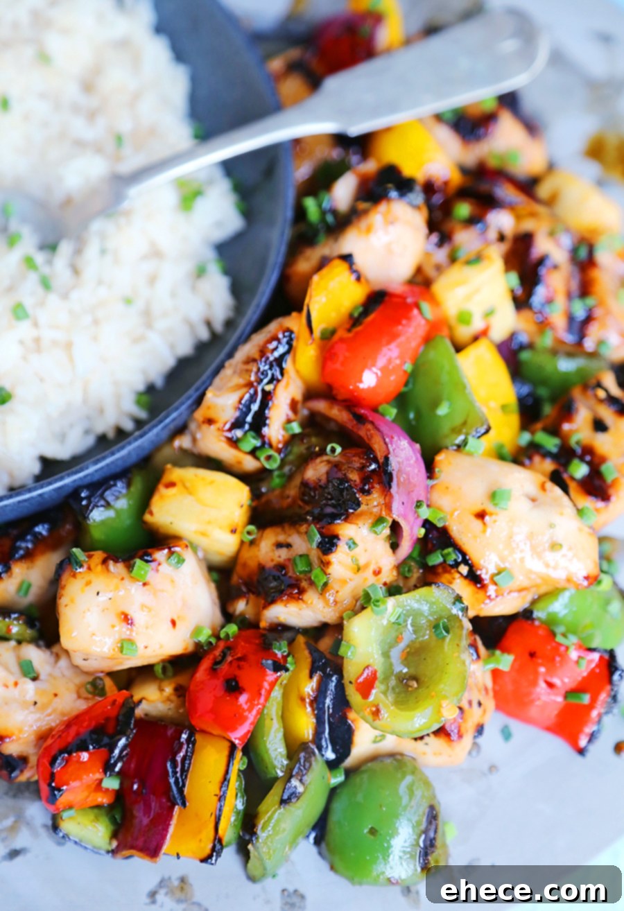 Island Glazed Chicken Skewers 5 A full platter of grilled Sweet Chili Hawaiian Chicken Skewers with garnish