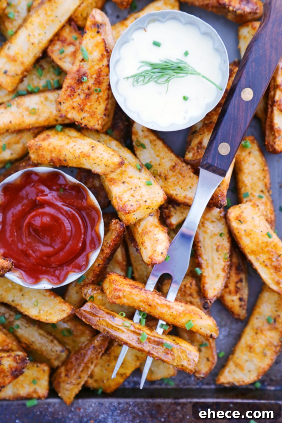Crispy Garlic Parmesan Potato Wedges on a baking sheet