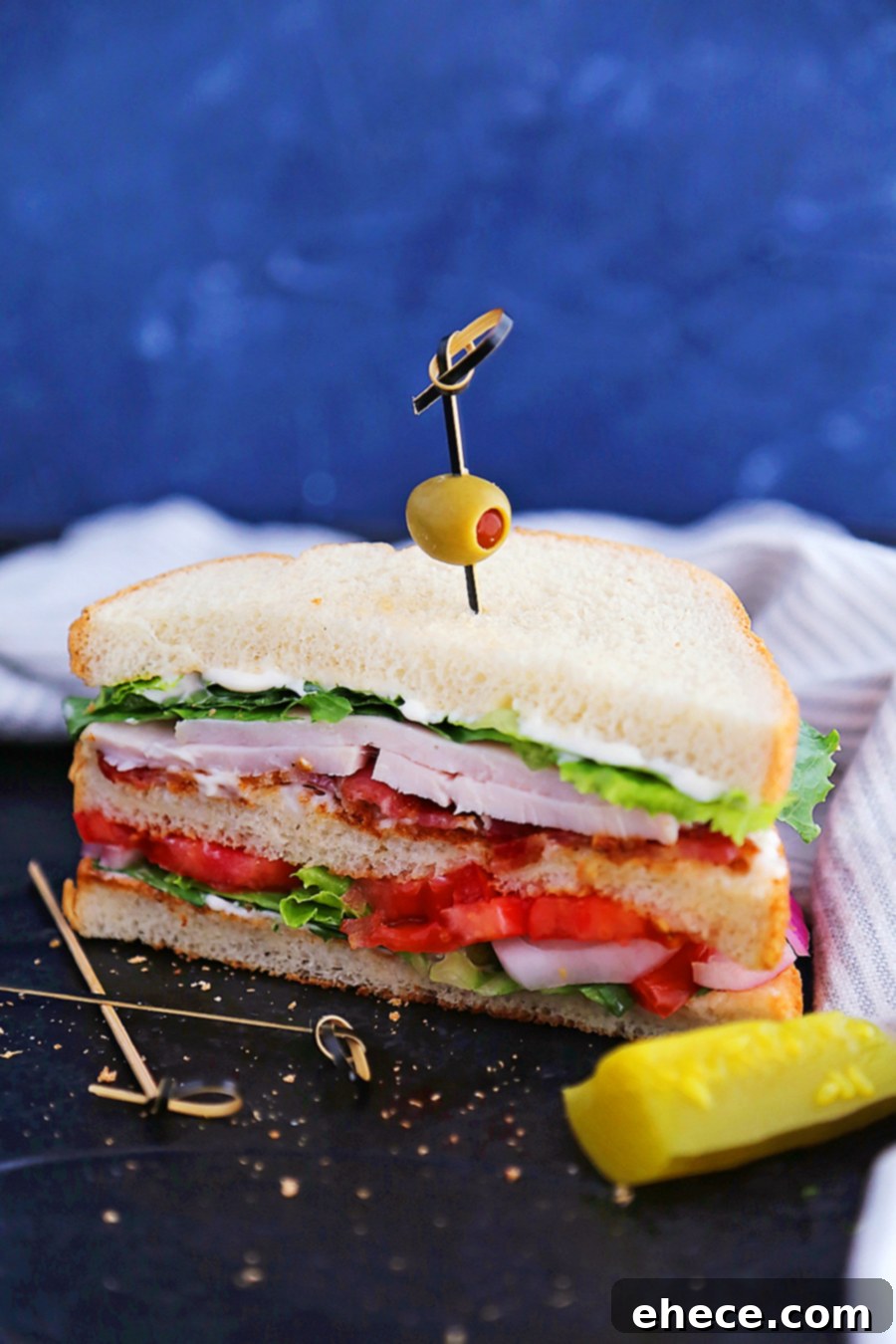 Elevated Turkey Bacon Club Sandwich 6 Final presentation of the Ultimate Turkey Bacon Club Sandwich with sides