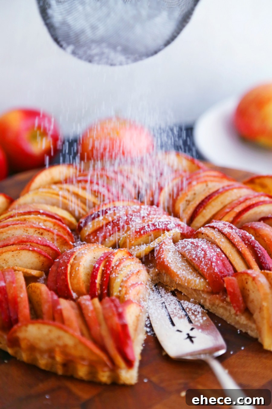 Golden Apple Tart dusted with powdered sugar