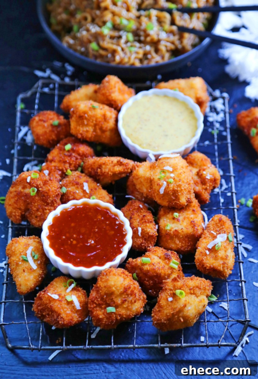 Tropical Crunch Popcorn Chicken 2 Crispy Coconut Popcorn Chicken, golden brown and perfectly cooked, ready to be served