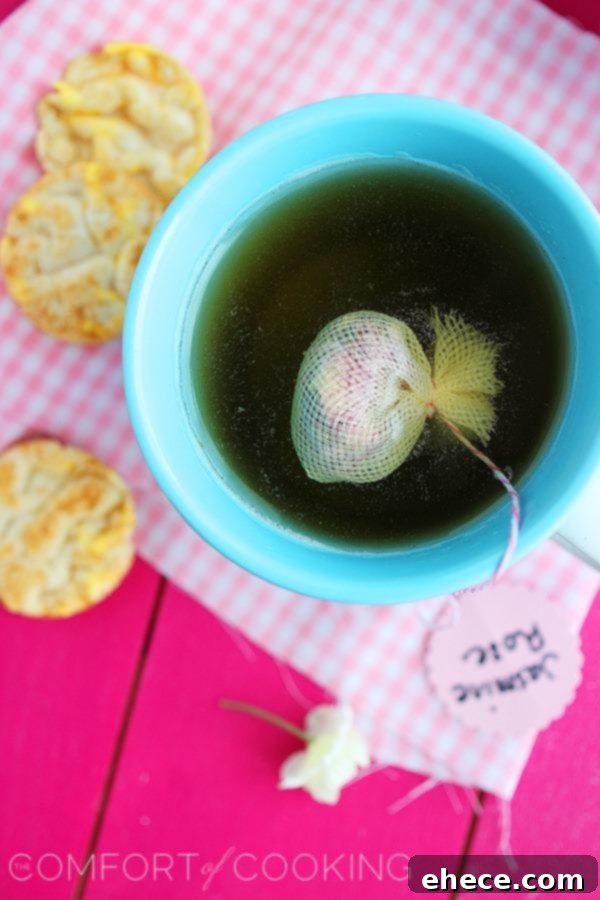 Beautifully presented homemade tea bags with personalized tags, nestled in a ceramic mug, ready for gifting.