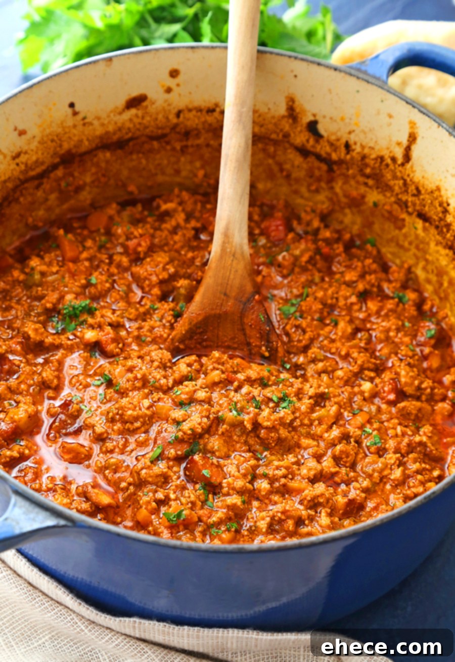 Hearty Tortellini Bolognese 3 A close-up of the rich, slow-simmered Bolognese sauce in a Dutch oven, ready to be served
