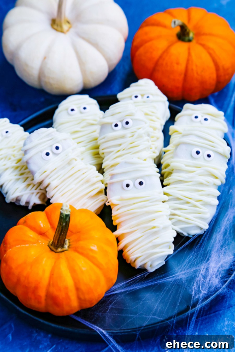 Adorable Nutter Butter Mummy Cookies arranged on a serving platter, ready for Halloween festivities.