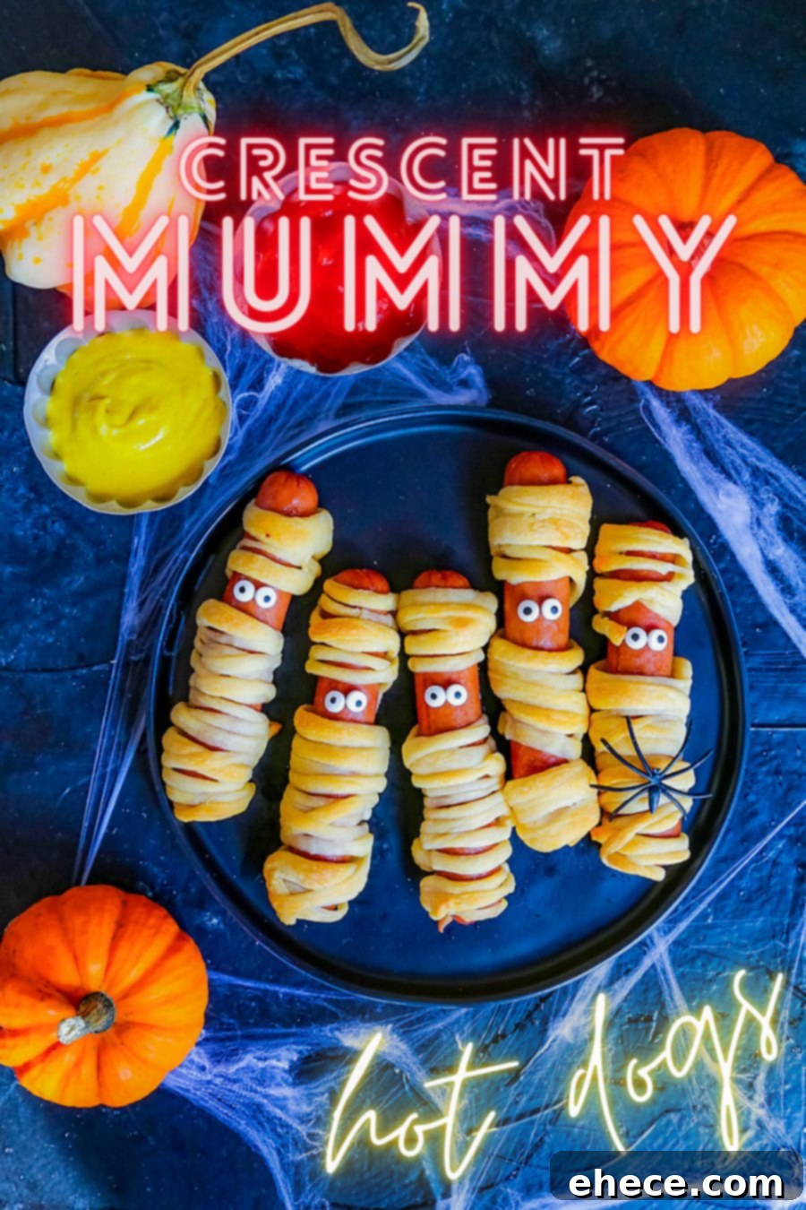 Mummy Hot Dogs served with ketchup and mustard for dipping