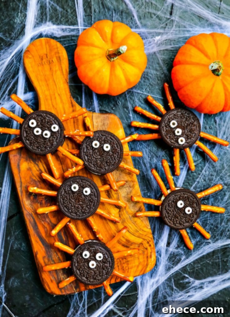 Oreo Pretzel Spider Cookies on a wooden board