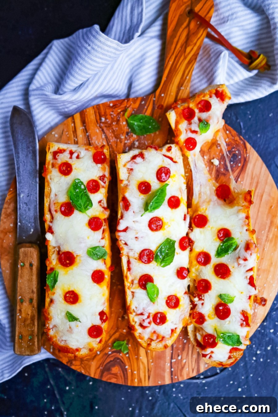 Delicious homemade French bread pizza topped with melted cheese and pepperoni, served on a baking sheet
