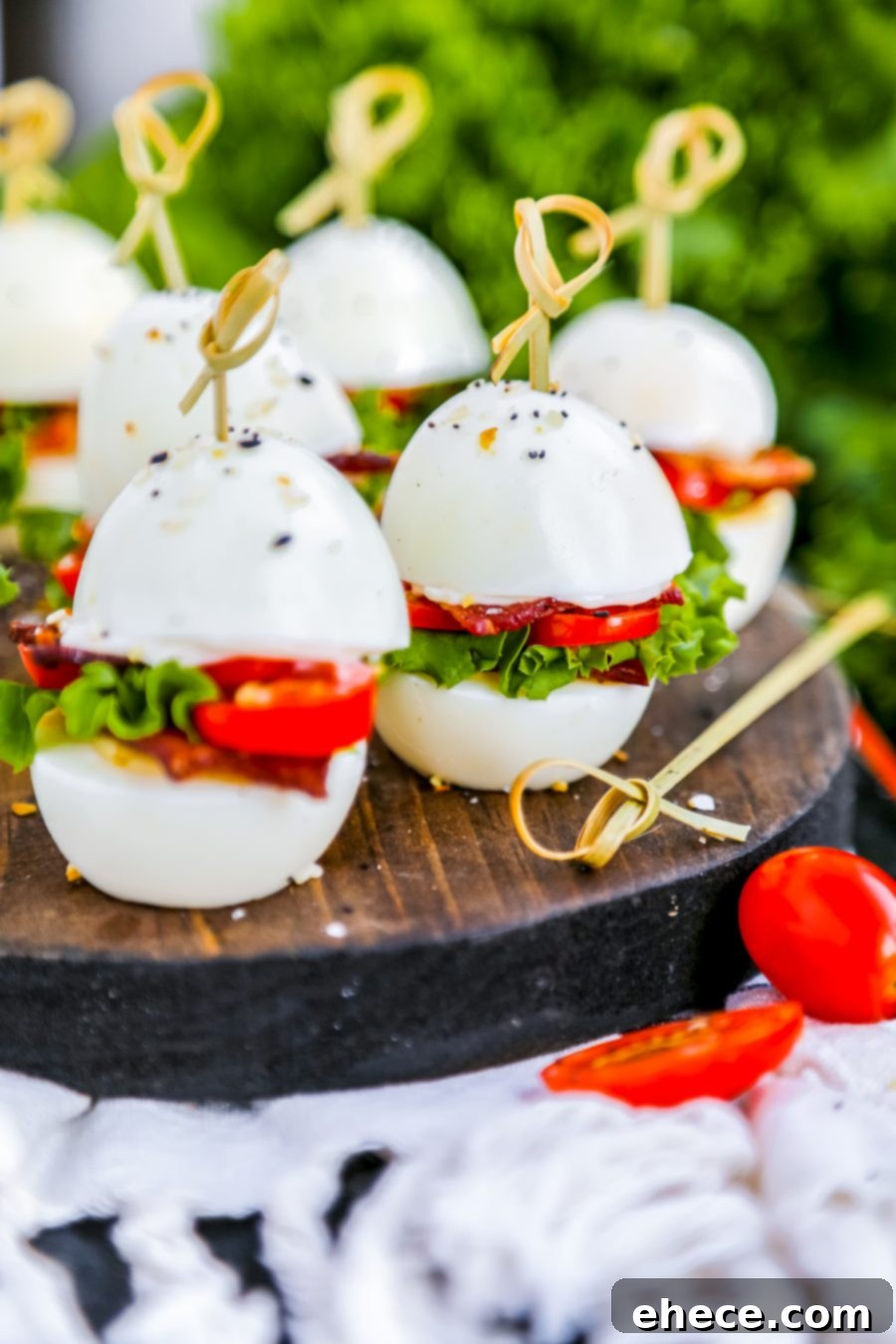 Fluffy Egg BLT Minis 4 Egg BLT Sliders arranged artfully on a serving dish.