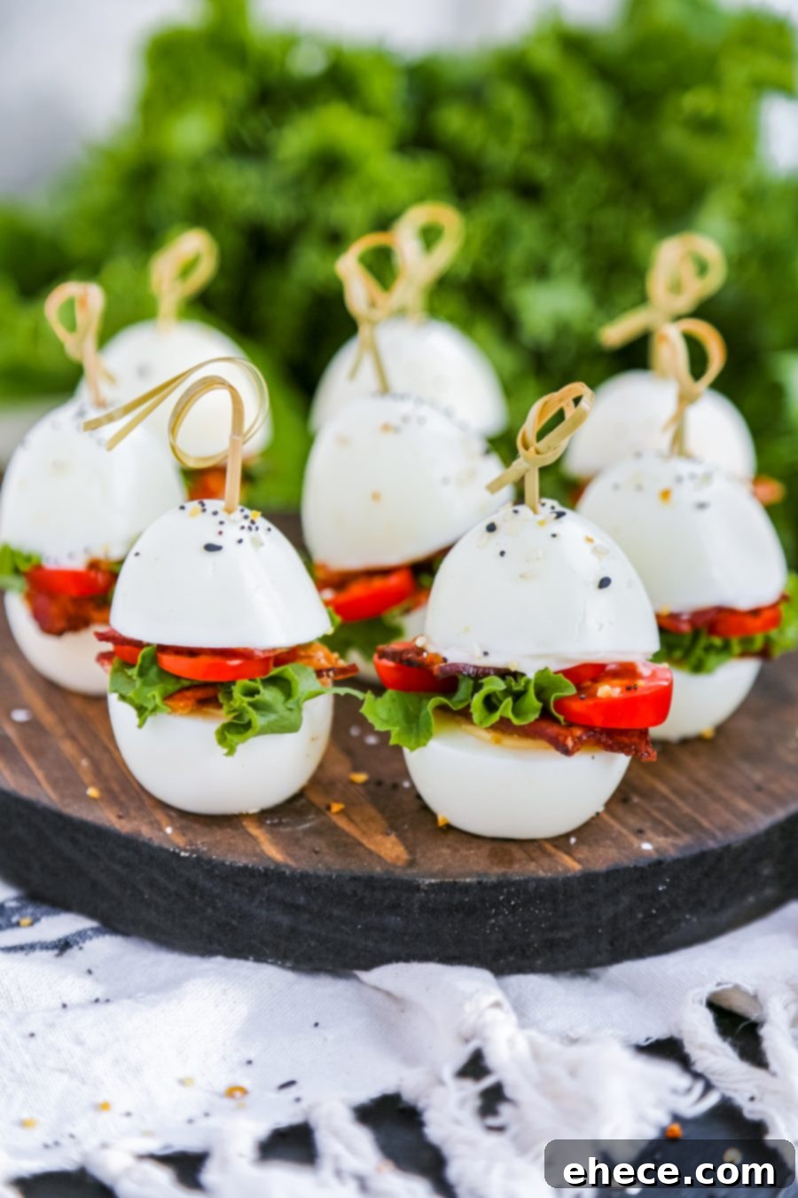 Fluffy Egg BLT Minis 5 A large platter of Egg BLT Sliders, showcasing their vibrant colors and appealing presentation.