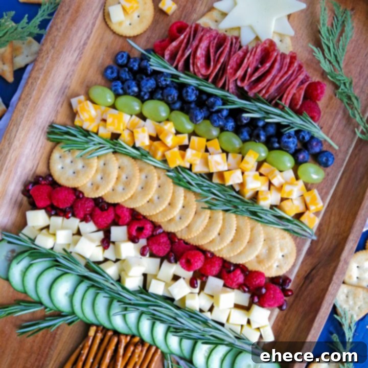 A stunning Christmas Tree Charcuterie Board featuring an array of cheeses, cured meats, fresh fruits, and crackers, beautifully arranged on a rustic wooden board, perfect for holiday entertaining.