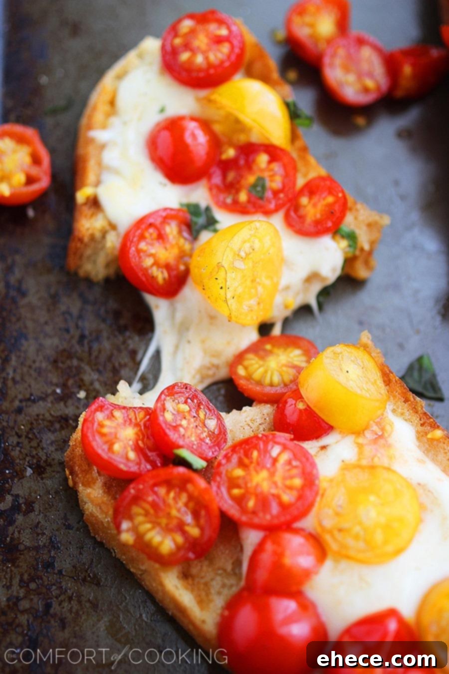 Freshly prepared Warm Tomato & Mozzarella Bruschetta on a wooden board.