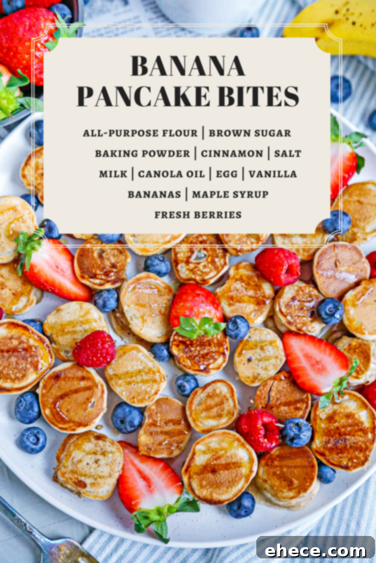 A full spread of banana pancake bites, fresh fruit, and syrup on a rustic wooden board