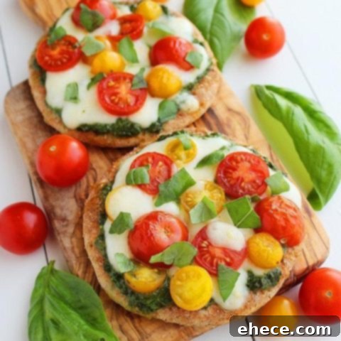 Wholesome Pesto Caprese Mini Pizzas 8 Mini Whole Wheat Pesto Caprese Pizzas recipe card image.