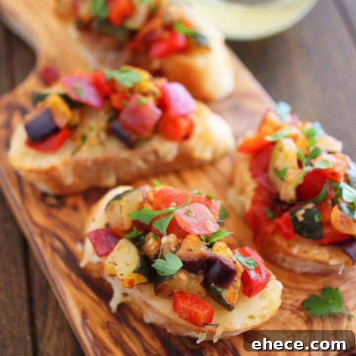 Vibrant Ratatouille Bites 6 Delicious Ratatouille Crostini appetizer with roasted vegetables and cheese.