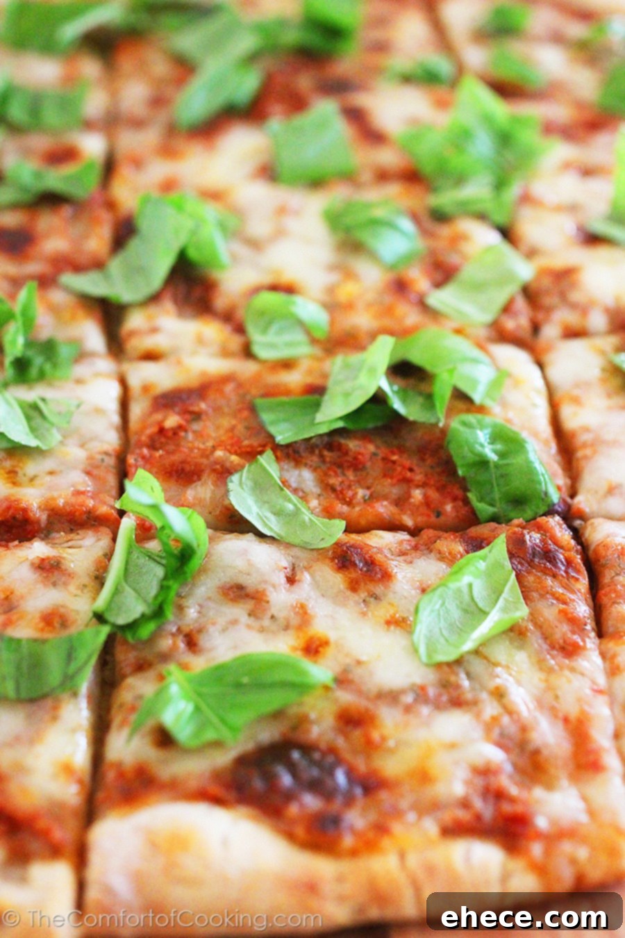 Timeless Margherita Pizza 5 A fresh Margherita pizza, half-sliced, revealing its vibrant ingredients and inviting texture.