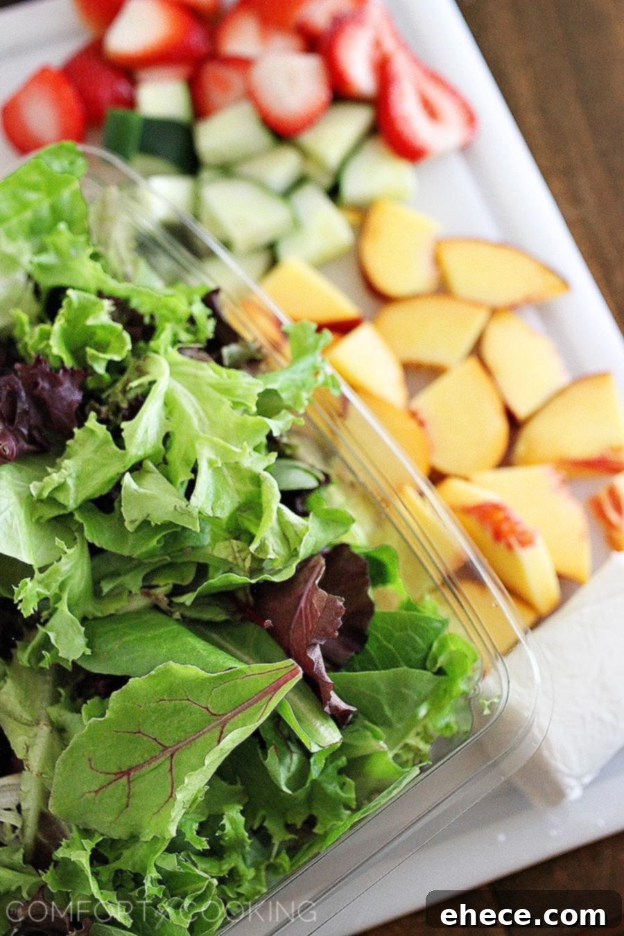 Summer Strawberry-Peach Salad with Goat Cheese – A vibrant blend of fresh peaches, strawberries, and cucumber, showcasing the salad's colorful appeal.