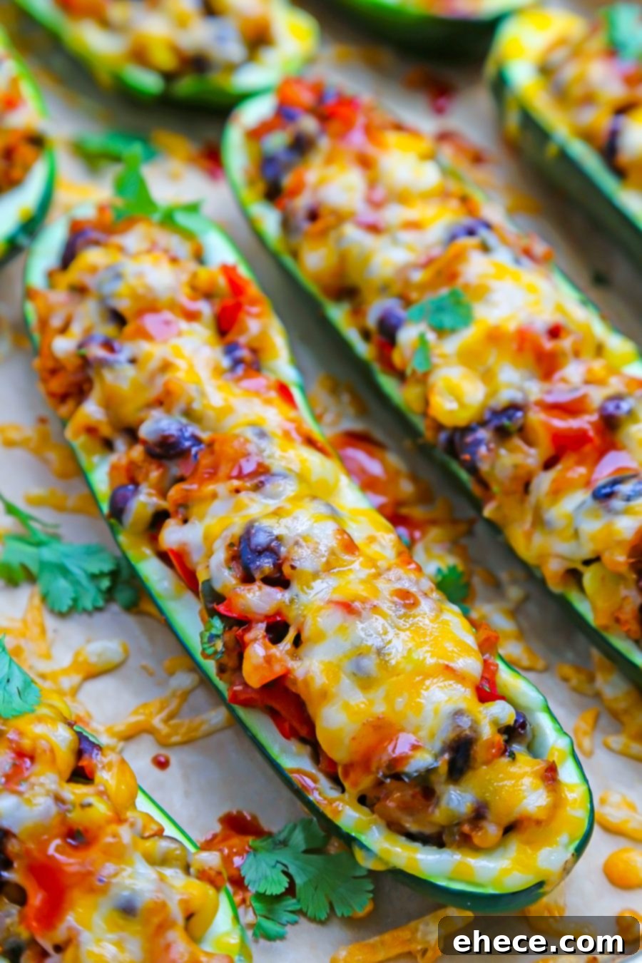 Fiesta Stuffed Zucchini 4 Close-up of baked zucchini boats with melted cheese