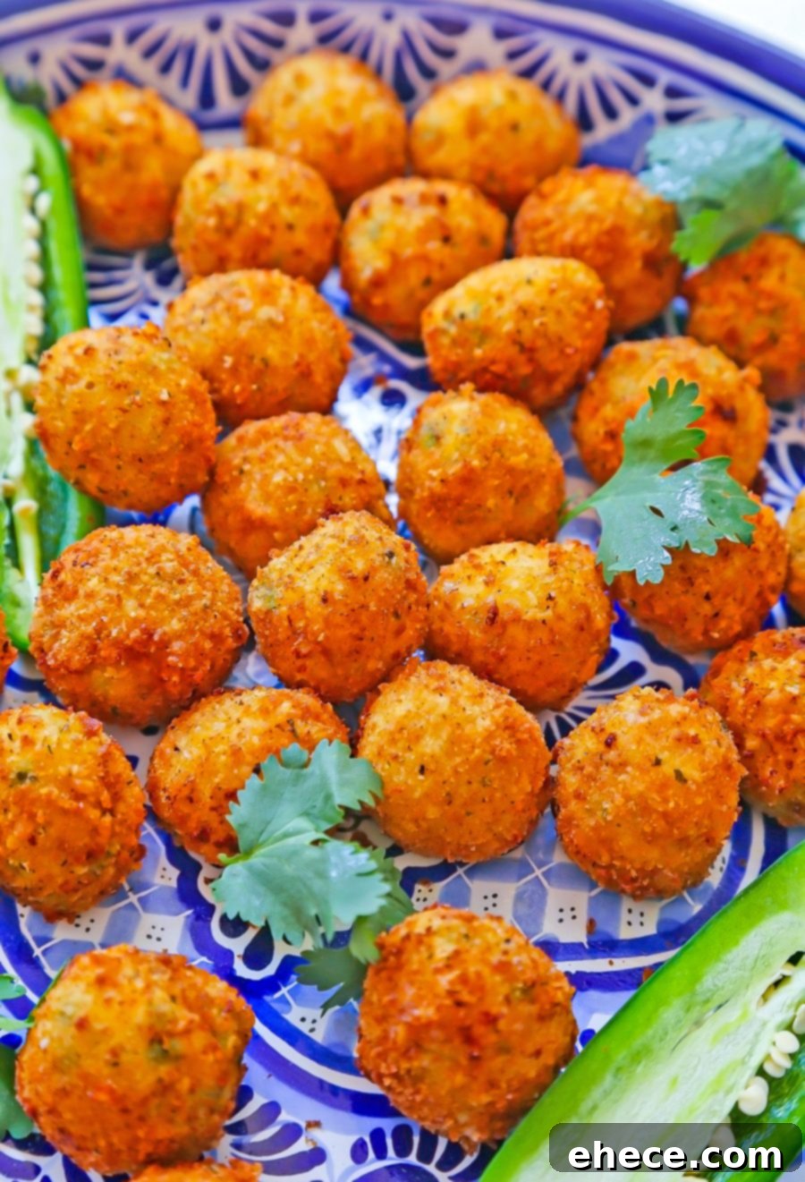 A close-up view of the perfectly golden-brown and crispy Jalapeño Popper Bites, showcasing their delicious texture.